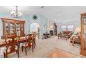 Inviting living room with light blue walls, fireplace, and an archway to other parts of the home at 9109 Galleon Dr, Orlando, FL 32819