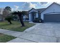 Beautiful home exterior featuring lush green lawn and well-maintained landscaping at 12546 Britwell Ct, Orlando, FL 32837