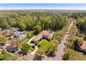 Expansive aerial view of the home showcasing its prime location and manicured grounds at 401 Timberwalk Ln, Lake Mary, FL 32746