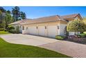 Spacious three-car garage with beautiful carriage lights and mature landscaping at 401 Timberwalk Ln, Lake Mary, FL 32746