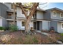 Inviting gray two-story townhome with lush front yard, mature tree and cozy entry at 710 Saint Matthew Cir # 710, Altamonte Springs, FL 32714