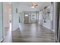 Inviting living area featuring stylish flooring, large windows, and a welcoming atmosphere at 16 Flamevine Ln, Debary, FL 32713