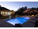 Backyard pool area with gazebo and screened in porch, great for outdoor lounging and entertaining at 1814 Old Stable Pt, Chuluota, FL 32766