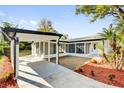 Beautiful home with a covered carport, decorative brickwork, and an abundance of natural light at 2012 Dorris Dr, Orlando, FL 32807