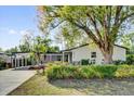 Charming single-story home featuring well-maintained landscaping and a convenient carport at 2012 Dorris Dr, Orlando, FL 32807