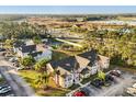 Aerial view of the community with well-maintained buildings, green spaces, parking, and neighborhood at 2030 Royal Bay Blvd # 62, Kissimmee, FL 34746