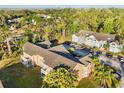 Aerial view of the condo community, showcasing lush landscaping, ample parking, and inviting architecture at 2030 Royal Bay Blvd # 62, Kissimmee, FL 34746