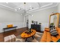 Stylish living room featuring hardwood floors, modern lighting, and contemporary decor at 2108 Delaney Ave, Orlando, FL 32806