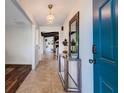 Inviting entryway features stylish décor, tile flooring, and a glimpse into the home's open living spaces and modern design at 2661 Jennifer Hope Blvd, Longwood, FL 32779