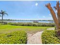 Expansive backyard with a tranquil lake view and private dock at 9137 Southern Breeze Dr, Orlando, FL 32836