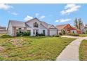 Charming two-story home featuring neutral siding, brick accents and a well-manicured lawn at 975 Cross Cut Way, Longwood, FL 32750