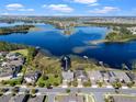 Aerial view of the neighborhood with lake access, docks, and lush landscaping at 10303 Atwater Bay Dr, Winter Garden, FL 34787