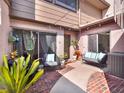 Back patio featuring brick pavers, outdoor seating, and access to home's interior at 1105 Woodbine St, Fern Park, FL 32730