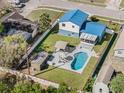 Aerial view of home showcasing backyard pool, patio, and fenced yard at 1189 Lazy Hollow Pl, Winter Park, FL 32792