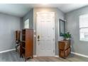 Inviting entryway with neutral paint, luxury vinyl plank flooring, and ample natural light at 14433 Pleach St, Winter Garden, FL 34787