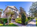 Well-maintained two-story townhome featuring a brick walkway and professional landscaping at 14433 Pleach St, Winter Garden, FL 34787