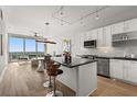 Modern kitchen featuring a breakfast bar, stainless steel appliances, and a beautiful view of the city at 150 E Robinson St # 2608, Orlando, FL 32801