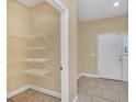 Bright entryway with tile floors, a coat closet, and direct access to the living areas at 2311 Whitley Ln, Winter Haven, FL 33881