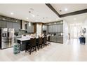 Spacious kitchen with gray cabinets, white countertops, stainless steel appliances, and a large island at 345 Aquamarine Way, Daytona Beach, FL 32124