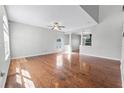 Spacious living room with hardwood floors, recessed lighting, and decorative columns at 5456 Crepe Myrtle Cir, Kissimmee, FL 34758
