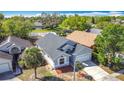 Birds-eye view of the house with a modern gray roof and well-kept surroundings, showing the property's location at 6921 Blair Dr, Orlando, FL 32818