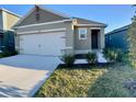 Attractive single-story home with a two-car garage, offering curb appeal at 994 King Parc Rd, Orange City, FL 32763
