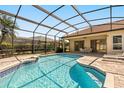 Screened-in pool with brick paver deck, lounge chairs, and outdoor dining area at 10337 Pointview Ct, Orlando, FL 32836