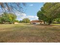 Expansive backyard with ample space, mature trees and a shed, offering endless possibilities at 11108 Rockport St, Orlando, FL 32836