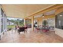 Spacious screened patio, perfect for outdoor dining and relaxation, complete with a built-in grill at 11108 Rockport St, Orlando, FL 32836