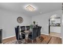 Formal dining room featuring a modern chandelier and stylish decor at 122 Carmel Bay Dr, Sanford, FL 32771