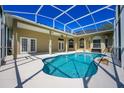 Private screened-in pool area offers a relaxing retreat with ample space for outdoor lounging and entertaining at 13552 Dornoch Dr, Orlando, FL 32828