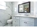 Modern bathroom featuring marble tiling, a sleek vanity, and a contemporary vessel sink at 1456 Providence Blvd, Deltona, FL 32725