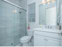 Modern bathroom with a glass-enclosed shower and white vanity at 14691 Walcott Ave, Orlando, FL 32827