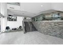 The lobby features a staircase, reception desk, and tile flooring at 151 E Washington St # 419, Orlando, FL 32801