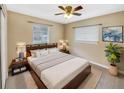 Serene main bedroom with a king-size bed, soft lighting, and a calming color palette for a restful retreat at 46 Morning Glory Dr, Debary, FL 32713