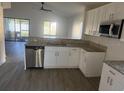 Bright kitchen with granite countertops, stainless steel appliances, and ample cabinet space at 1059 Manigan Ave, Oviedo, FL 32765