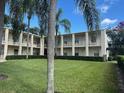 Apartment building featuring lush greenery and multiple residential units at 225 E New Hampshire St # 20, Orlando, FL 32804