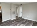 Living room featuring laminate floors and a neutral color palette at 225 E New Hampshire St # 20, Orlando, FL 32804