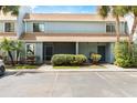 Townhouse featuring covered parking and a well-manicured lawn at 40 Moree Loop # 11, Winter Springs, FL 32708