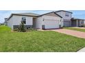 This is a lovely single-story home with a two-car garage, and well-maintained lawn at 4550 Windy Oak Way, St Cloud, FL 34772