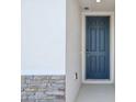 This home features a stylish blue front door with a modern smart lock at 4550 Windy Oak Way, St Cloud, FL 34772