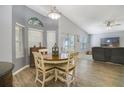 Cozy dining area with a window view, seamlessly connected to the living room at 4638 Destrehan, Leesburg, FL 34748