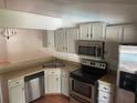 Updated kitchen with stainless steel appliances and breakfast bar at 5417 Lake Margaret Dr # 39, Orlando, FL 32812