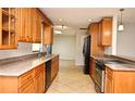 Stylish kitchen featuring granite countertops, stainless appliances, and ample cabinet space at 122 W Hillcrest St, Altamonte Springs, FL 32714