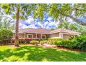 Beautiful single-story home with lush green lawn, mature landscaping, and an attached two-car garage at 1272 Mount Logan Dr, Apopka, FL 32712