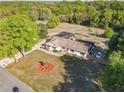 Expansive property with a screened pool, lush landscaping, and ample space at 133 Orange Ridge Dr, Longwood, FL 32779