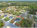 Aerial view of a new construction in a wooded area with a red line indicating property lines at 16121 Sw 37Th Terrace Rd, Ocala, FL 34473