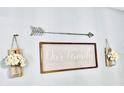A decorated wall with an arrow and a sign that says 