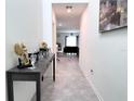 Inviting hallway with modern decor and a view into the living area at 1902 Presley Pl, Kissimmee, FL 34746