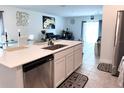 Bright, open kitchen featuring stainless steel appliances, a stylish island and modern finishes at 1902 Presley Pl, Kissimmee, FL 34746